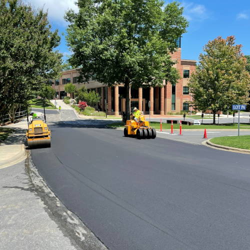 Small Road Project - Finishing with Rollers Finishing paving with roller equipment